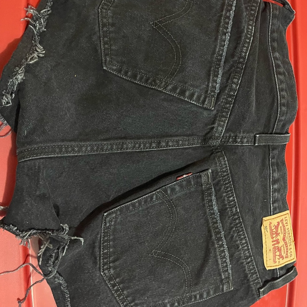 Levi’s 501 high waisted, distressed, button fly shorts-black